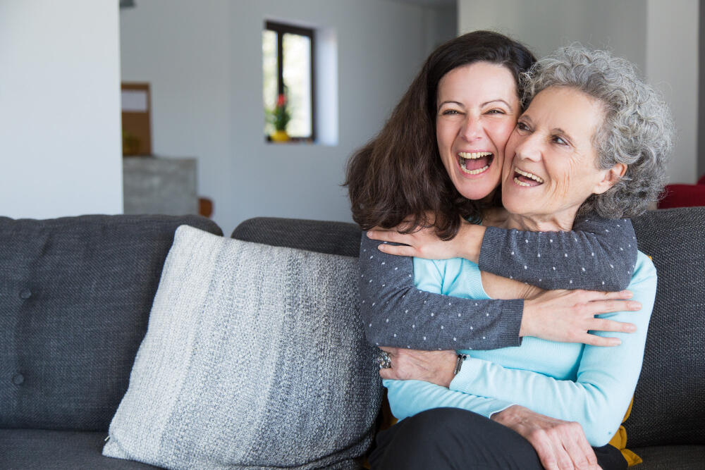 portrait-of-happy-mid-adult-woman-embracing-her-senior-mother.jpg